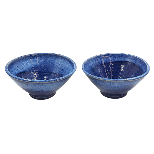 Two Leafbud Sapphire wok bowls in a speckled sapphire-blue glaze