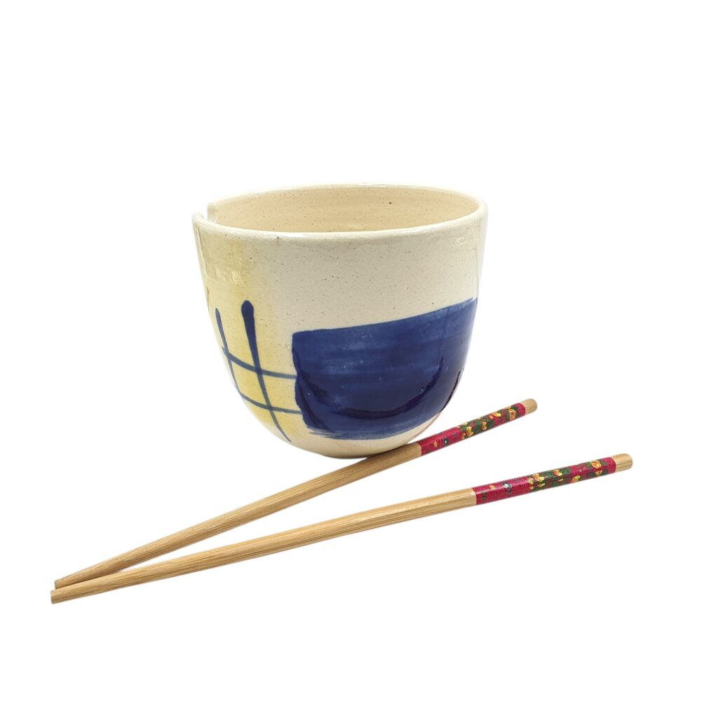 Front view of the Leafbud Whispers ramen bowl showing its bold cobalt block, yellow wash and hand-drawn grid