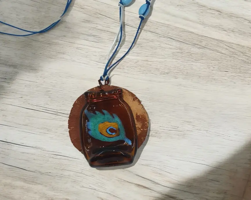 Handmade glass pendant with artistic peacock feather design – Leafbud Earth collection